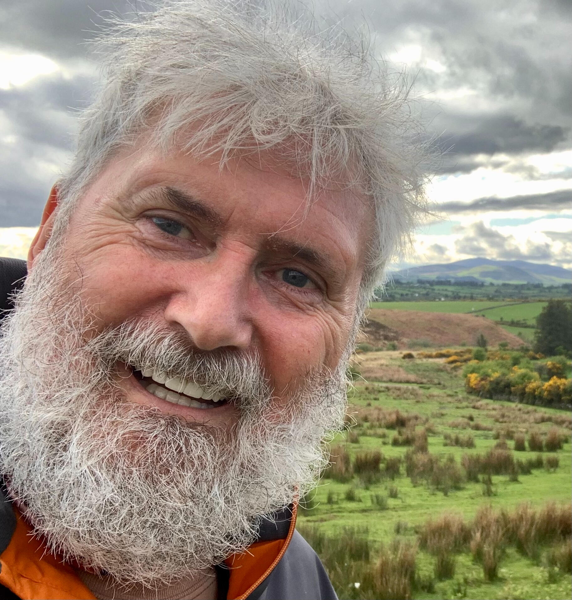 Kevin MacAlan, poet, pictured in front of Waterford fields.