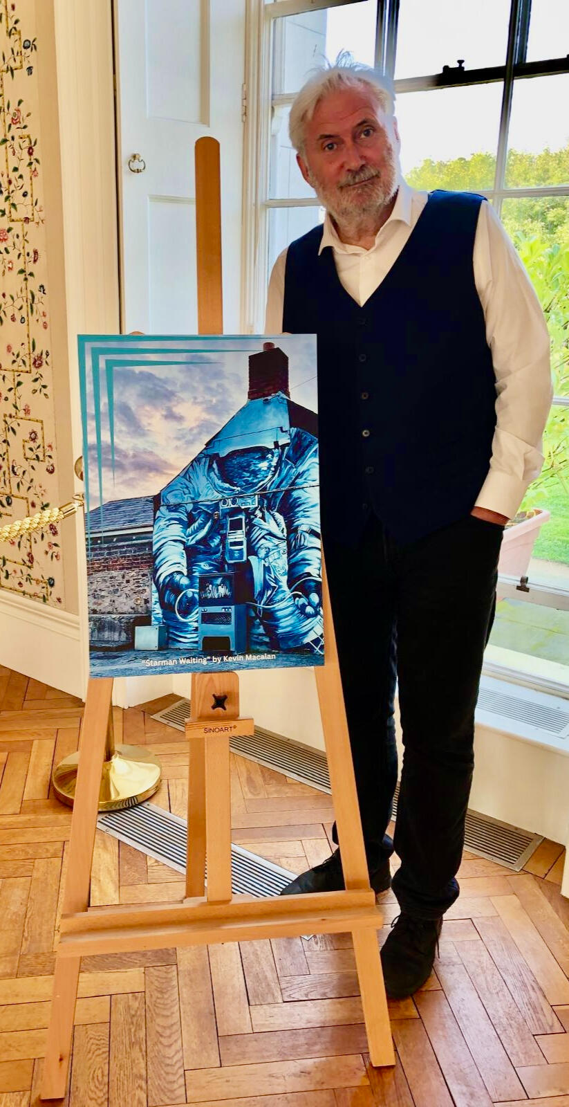 Artist Kevin MacAlan photographed beside his picture Starman Waiting. Artist Kevin MacAlan photographed beside his picture Starman Waiting.