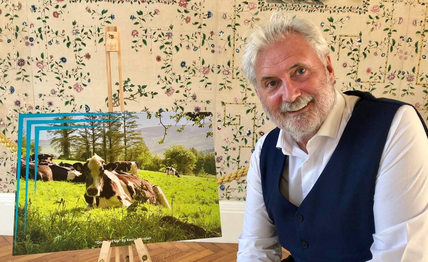 Artist Kevin MacAlan photographed beside his picture Don't Get Up. Artist Kevin MacAlan photographed beside his picture Don't Get Up.